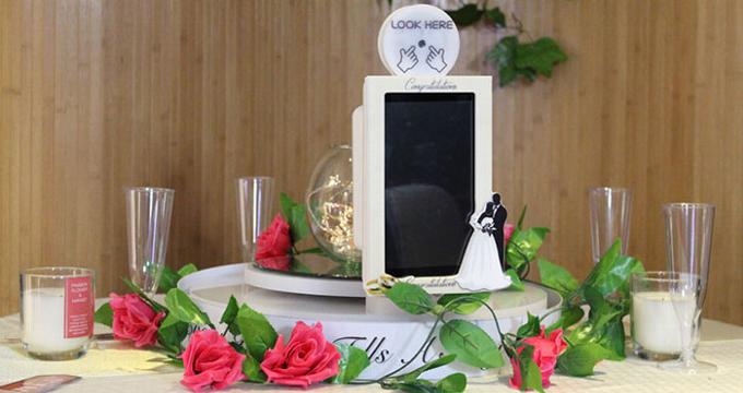 A table-top selfie mirror set up for a wedding reception